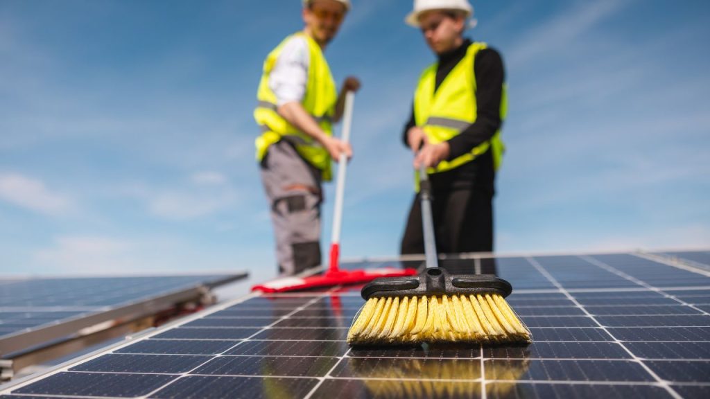 cleaning off solar panels for client in Jacksonville Beach - Clay Solar Installation Partners